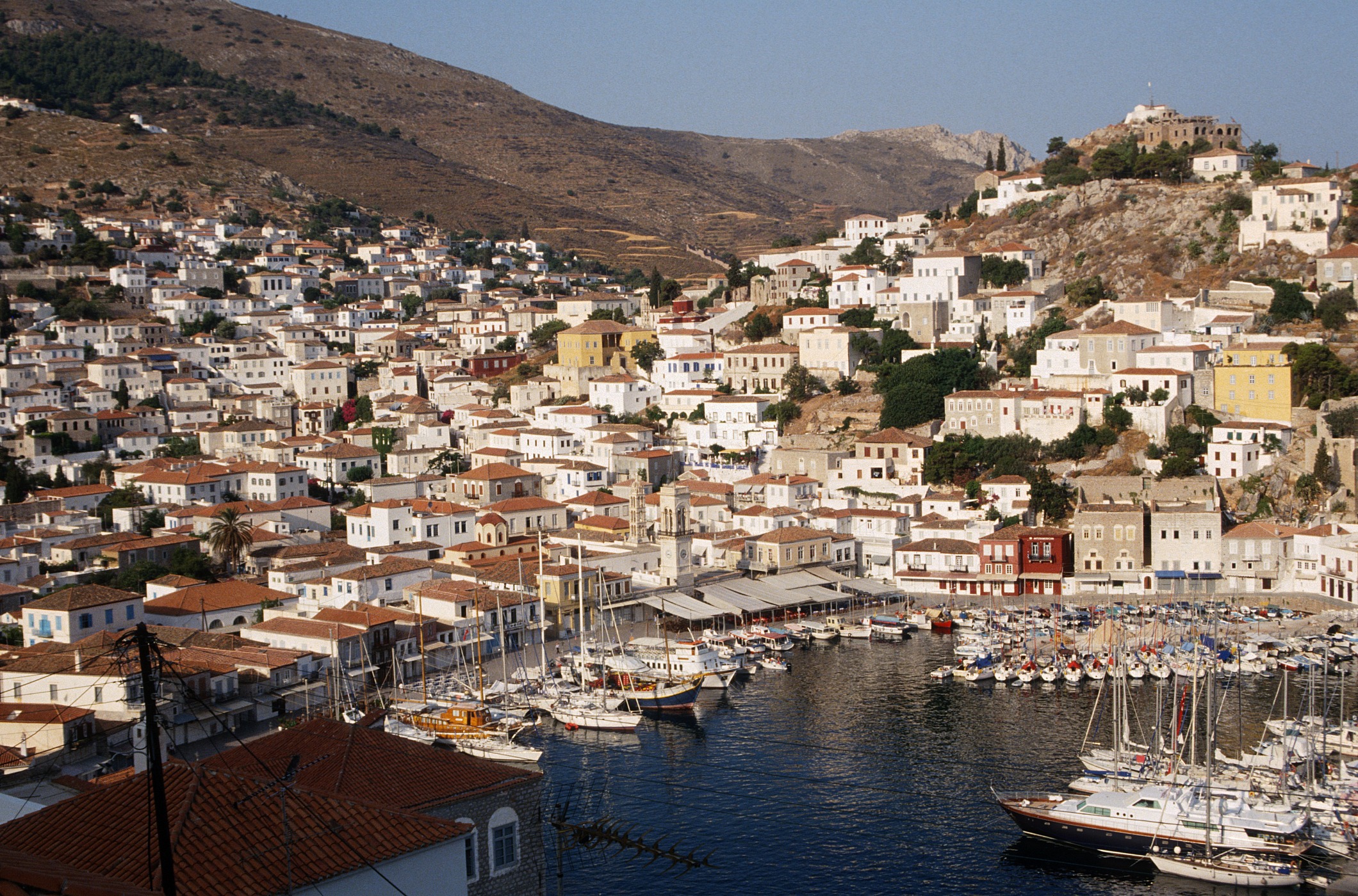 Hydra harbor at sunrise with calm water